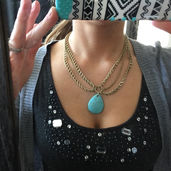 🆕gold necklace with blue stone.