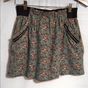 Greenish colored floral mini skirt