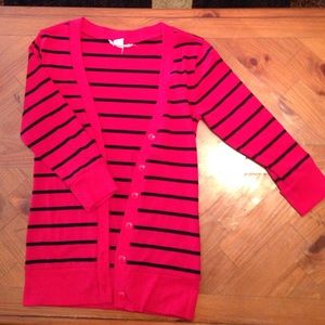 Red and black cardigan.