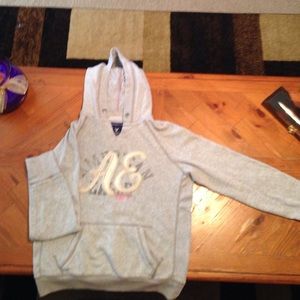 Light grey hoodie.