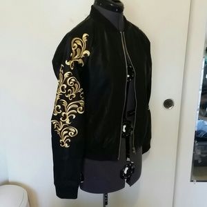 Black faux leather bomber w/filigree detail