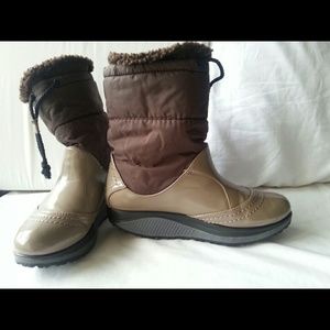 Arced running snow boots