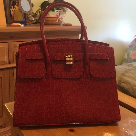Also red snakeskin purse