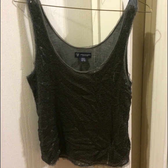 Grey sequined tank top .