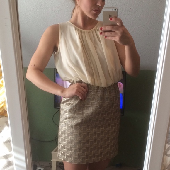 Beige and gold dress with gold jewelry detail