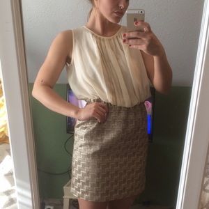 Beige and gold dress with gold jewelry detail