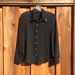 Sheer black button-up with gold trim.