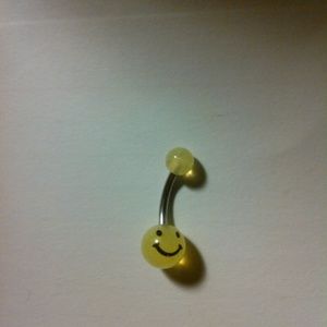 Smiley face belly ring