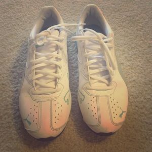 Teal and white Puma sneakers