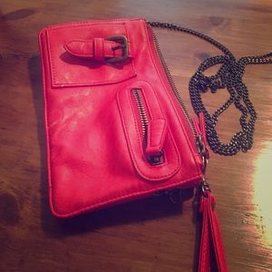 Urban Outfitters red purse with chain strap.