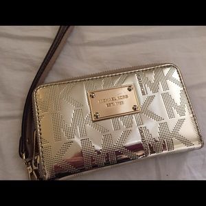 Gold Michael Kors wristlet.