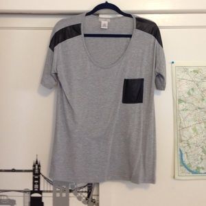 Grey shirt with black leather