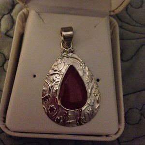 Sterling silver natural ruby pendant.