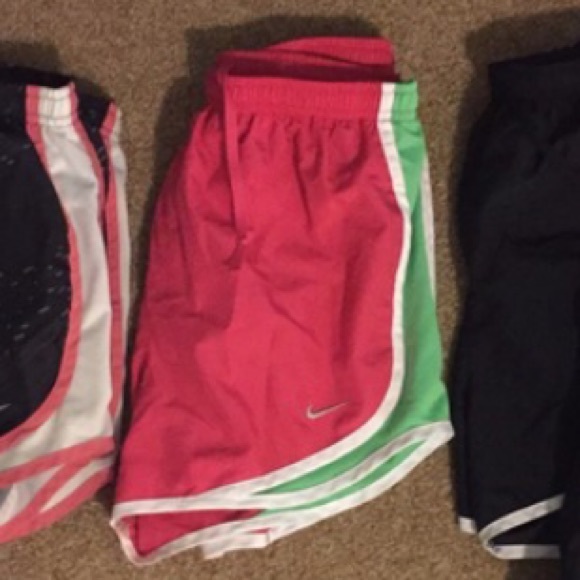 Pink and green Nike tempos