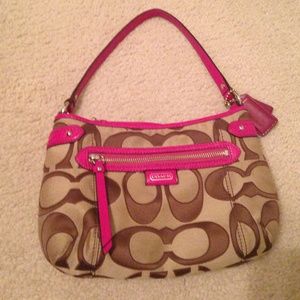 Tan, brown, and pink logo coach purse.