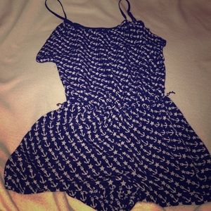 Navy blue romper with creme anchor and star prints
