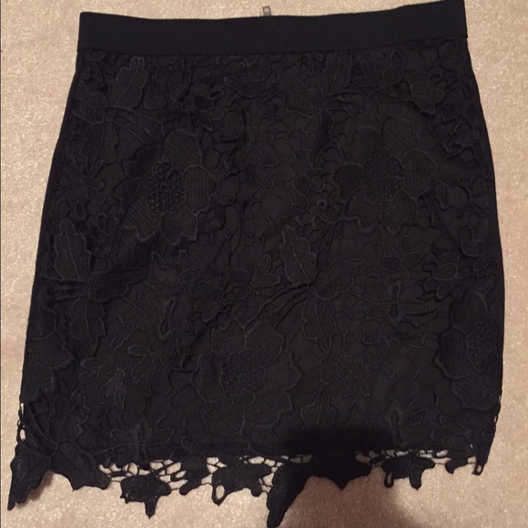 black skirt with flower design on front. size 4