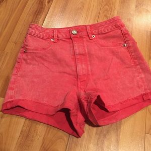 Faded red high-waisted denim shorts