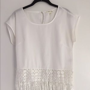 White sheer top with fringe.