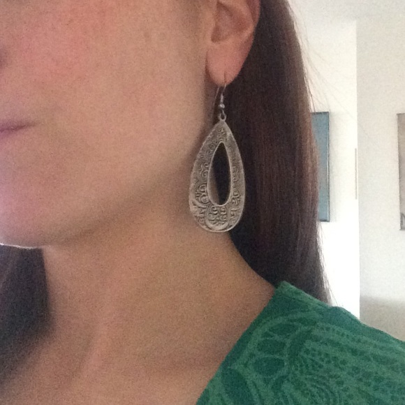 Silver oval hoop earrings with design