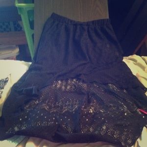 Lace hi-low skirt.