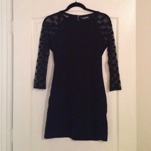 EXPRESS black dress with polka dot sleeves.