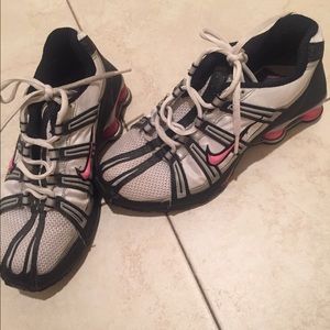 Pink and black Nike shocks