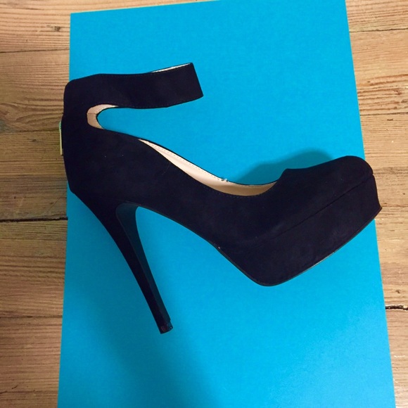 Black suede heel with ankle strap.