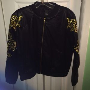 Faux Leather Jacket . Gold Designs On The Sleeves