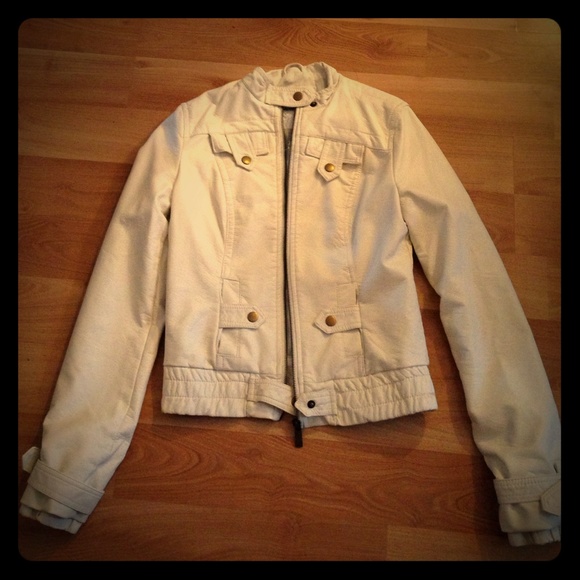 Fitted white faux leather jacket.