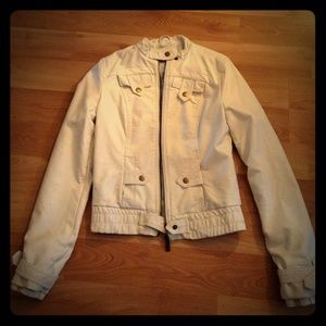 Fitted white faux leather jacket.