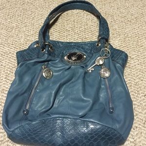 Blue Sienna Ricchi purse.