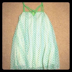 Green and white dress, cut out neck detail..