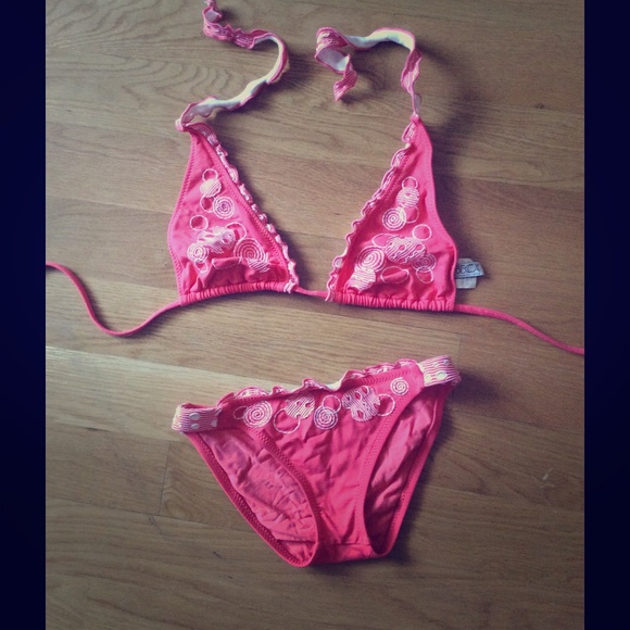 Coral Becca bikini with white detail.