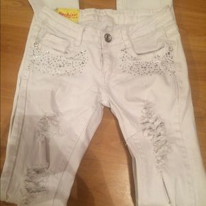 Distressed white jeans
