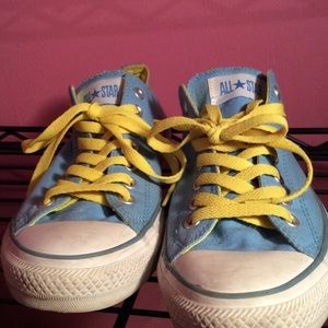 Converse light blue with yellow insoles and laces.