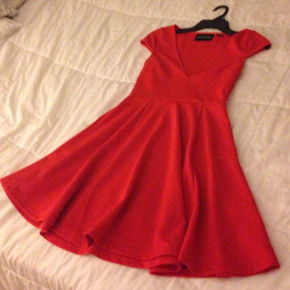 Dark orange fit and flare dress.