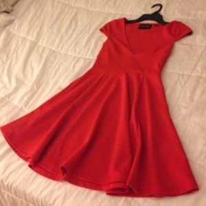 Dark orange fit and flare dress.