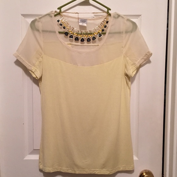 Soft yellow blouse.