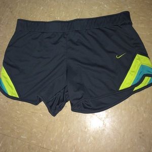 Gray Nike running shorts.