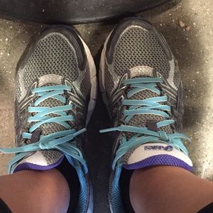 Light blue and gray Asics running shoes