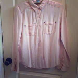 pink long sleeve top.