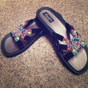 Black sandals with rainbow beaded embellishments