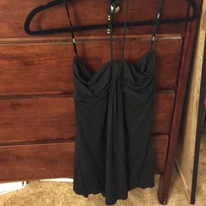 tart black halter top with gold accents.