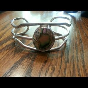 Handmade sterling silver and shell bracelet.