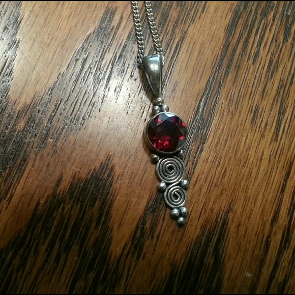 Handmade sterling silver and Garnett pendant.