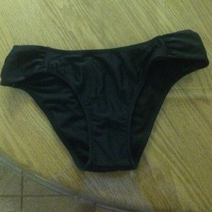 Black bathing suit bottoms never worn. Runs small