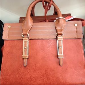 Get a FREE Wallet with a Handbag purchase.