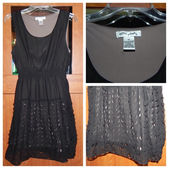 Frilly black dress with cutouts