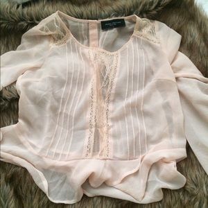 Sheer peach blouse with great lace details